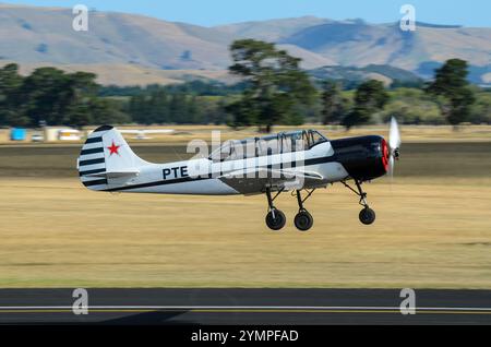 Yakovlev Yak-52 plane taking off at Wings over Wairarapa airshow at Hood Aerodrome, Masterton, New Zealand Stock Photo