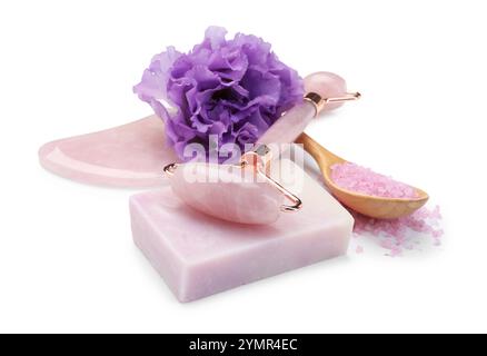 Face roller, soap, gua sha, sea salt and flower isolated on white Stock Photo