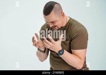Man Expressing Emotion with Hands Raised. Stock Photo