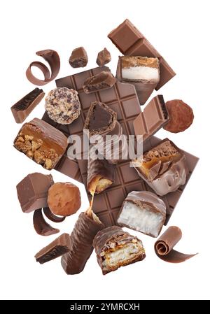 Different chocolate products in air on white background Stock Photo