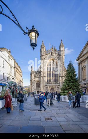 Bath Abbey and Abbey Churchyard bathed in sunset light with Christmeas tree and decorations in Bath, UK on 22 November 2024 Stock Photo