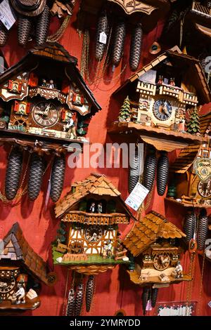 Cuckoo clocks on a shop wall  – Bruges, Belgium – 23 October 2024 Stock Photo