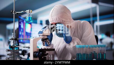 Research Lab Scientist Doing Medical Scientific Test With Microscope Stock Photo