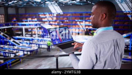 Engineer Worker Using Warehouse Automation Dashboard In Logistic Center Stock Photo