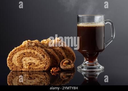 Dessert with walnuts and coffee on a black reflective background. Cake with brown sugar, walnuts, and cream. Copy space. Stock Photo