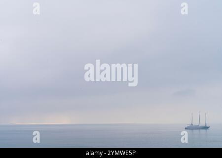 Big ship sailing in the sea, alone on the horizon line. Stock Photo