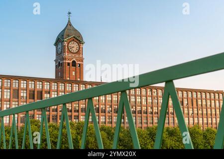 Iconic Ayer Mill clock tower and nineteenth century brick mill building in the historic immigrant city of Lawrence Massachusetts. Stock Photo