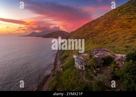Stunning Caribbean sunset with orange, pink, purple sky in St Kitts and Nevis Stock Photo
