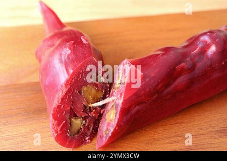 Closeup of Georgian Traditional Candy Stick Coating Chopped Nuts with Grape Juice Called Churchkhela Stock Photo