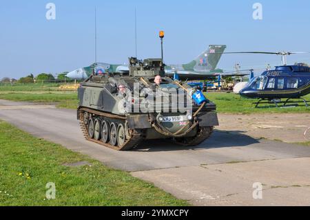 Vintage, historic preserved military history on display. Former Royal Air Force Avro Vulcan bomber XL426 and British Army FV103 Spartan CVRT, driving Stock Photo