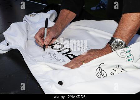 Las Vegas, NV, USA. 22nd Nov, 2024. Chef Wolfgang Puck autographs his Chef's jacket during the Bellagio Fountain Club open in Las Vegas, NV. Christopher Trim/CSM/Alamy Live News Stock Photo