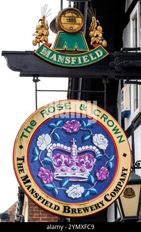 Traditional hanging pub sign at The Rose & Crown - A Mansfield Brewery Company public house - Market Place, Hornsea,, Yorkshire, England, UK Stock Photo