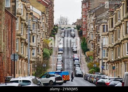 Glasgow, UK, November 16th 2024, Tenement flats on steep hill in busy residential area Stock Photo