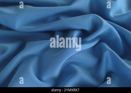 A cerulean blue fabric texture background. Close up. Stock Photo