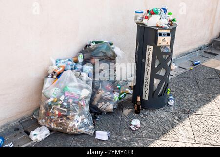Naples Napoli Italy,trash can container bags,overflowing full litter,urban waste management disposal,cleanliness issue,plastic bottles,environmental a Stock Photo