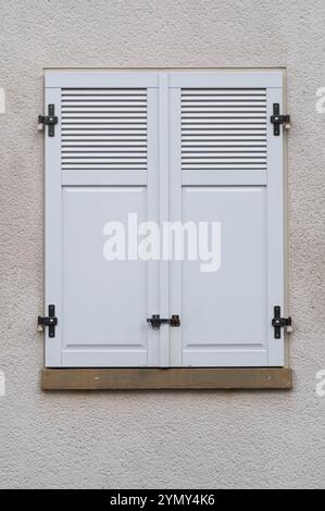 Windows with grey metal shutters Stock Photo