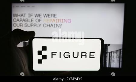 Stuttgart, Germany, 07-11-2024: Person holding cellphone with logo of US artificial intelligence robotics company Figure AI Inc. in front of webpage. Stock Photo