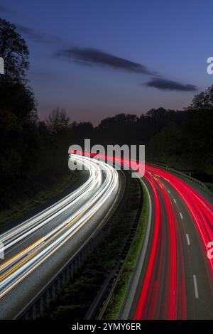 Long exposure of a motorway at night with red and white light trails of cars, Winnenden, Baden-Wuerttemberg, Germany, Europe Stock Photo