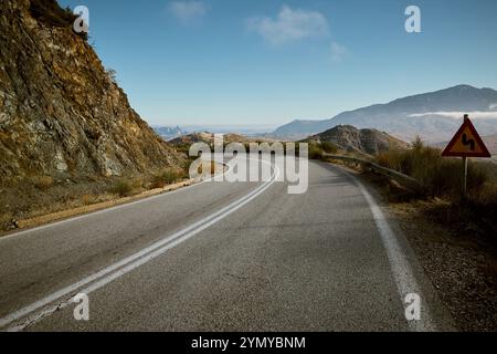 Sharp turn on mountain road Stock Photo