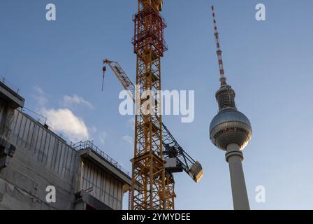 Berlin, Germany. 23rd Nov, 2024. View of the Berlin television tower and construction cranes on a building site. Credit: Hannes P. Albert/dpa/Alamy Live News Stock Photo