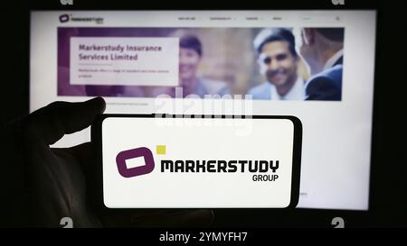 Stuttgart, Germany, 06-27-2024: Person holding cellphone with logo of British insurance company Markerstudy Group Limited in front of business webpage Stock Photo