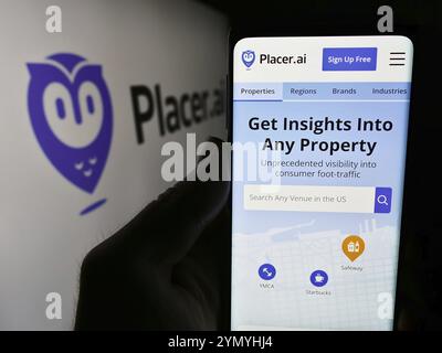 Stuttgart, Germany, 05-08-2024: Person holding cellphone with webpage of US traffic analytics software company Placer Labs Inc. with logo. Focus on ce Stock Photo