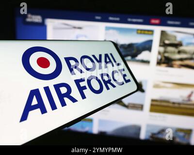 Stuttgart, Germany, 03-25-2024: Cellphone with logo of United Kingdom air and space force Royal Air Force (RAF) in front of website. Focus on center-l Stock Photo