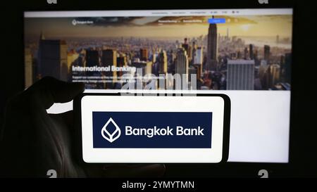 Stuttgart, Germany, 06-07-2024: Person holding cellphone with logo of Thai Bangkok Bank Public Company Limited in front of business webpage. Focus on Stock Photo