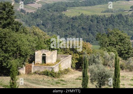 A small derelict cemetery near the Cellole monastery in the beautiful landscape of the Tuscany, Italy, Europe Stock Photo