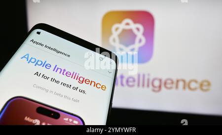 Stuttgart, Germany, 07-03-2024: Mobile phone with website of AI platform Apple Intelligence in front of business logo. Focus on top-left of phone disp Stock Photo