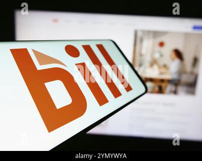 Stuttgart, Germany, 04-18-2024: Smartphone with logo of American financial software company BILL Holdings Inc. in front of business website. Focus on Stock Photo