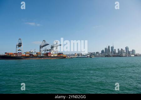 Container ship being loaded (or unloaded) in Auckland New Zealand Stock Photo