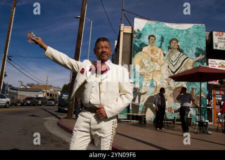 Mariachis gather at Mariachi Plaza on a Sunday in hopes of being hired to play their music at a party or a restaurant. Stock Photo