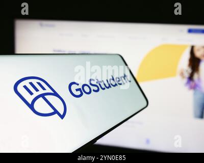 Stuttgart, Germany, 06-01-2024: Smartphone with logo of Austrian education technology company GoStudent GmbH in front of business website. Focus on ce Stock Photo