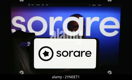 Stuttgart, Germany, 05-21-2024: Person holding cellphone with logo of French crypto fantasy sport company Sorare SAS in front of business webpage. Foc Stock Photo