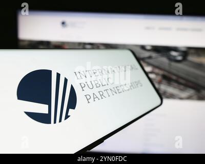 Stuttgart, Germany, 03-20-2024: Mobile phone with logo of British company International Public Partnerships Limited in front of business website. Focu Stock Photo