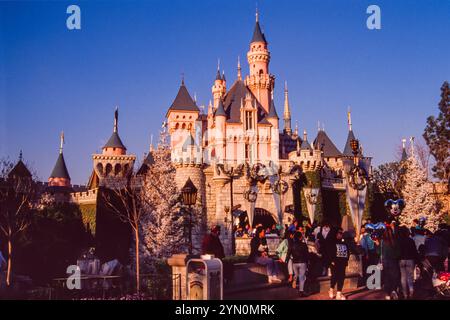 Sleeping Beauty Castle a fairy tale castle at the center of Disneyland in California that is based on the late 19th-century Neuschwanstein Castle in Bavaria, Germany. Pictured shortly before Christmas 1988, two Christmas trees can be seen in front of  the entrance. The castle opened 1955, when the park was opened, and is the oldest of all Disney castles. Disney's movie, Sleeping Beauty, was not released until 1959. Stock Photo