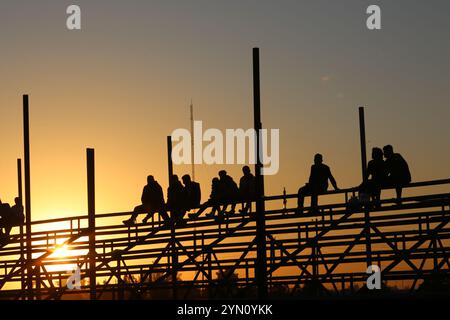 Baghdad, Iraq. 23rd Nov, 2024. People watch the Red Bull Car Park Drift-Iraq in Baghdad, Iraq, on Nov. 23, 2024. Credit: Khalil Dawood/Xinhua/Alamy Live News Stock Photo