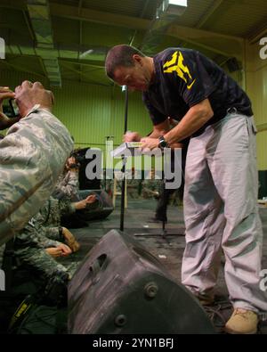 Athlete and seven time Tour de France winner Lance Armstrong signing autographs for service members at Contigency Operating Base Speicher, Iraq after speaking at the 2007 USO Christmas Tour. Stock Photo