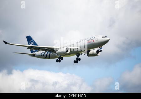 Auckland, New Zealand - November 24 2024: China Eastern Airbus Flying towards Auckland International Airport. Stock Photo