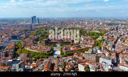 Stunning aerial view of Milan’s Castle Sforza with its expansive gardens, framed by the dynamic city skyline featuring modern and historical architect Stock Photo