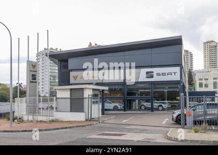 Modern seat car dealership building showcasing prominent logo signage ...