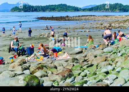 Local residents enjoying a sunny day, having fun and relaxing at the Pacific Ocean and Sandy Beach State Park in Sitka, Alaska, USA. Stock Photo