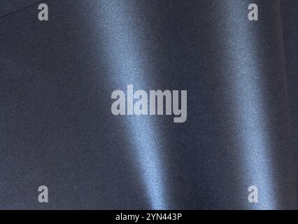 Dark metallic paper background with a glossy, smooth texture and gradient tones. Elegant and luxurious design featuring shimmering blue and black surf Stock Photo