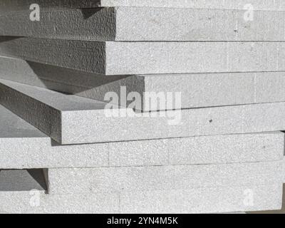 Close-up image of stacked insulation foam boards, highlighting texture and material quality. Ideal for construction, building insulation, and DIY home Stock Photo