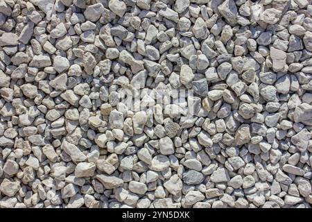 Abstract background with Grey pebble stones. Grunge urban texture. Grunge background. Abstract textured effect. Stock Photo