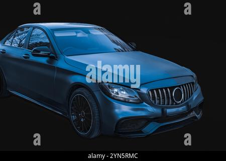 New Metallic blue luxurious spot car on black background, side view on modern elegant car. Fast sports car. Stock Photo