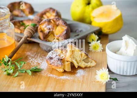 cooked cottage cheese muffins with quince and honey . Stock Photo