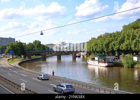 Saarbrücken, Saarland in Germany - August 06 2024: walking along the riverbank of the Saar River Stock Photo