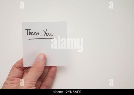 Words thank you written on sticky note Stock Photo